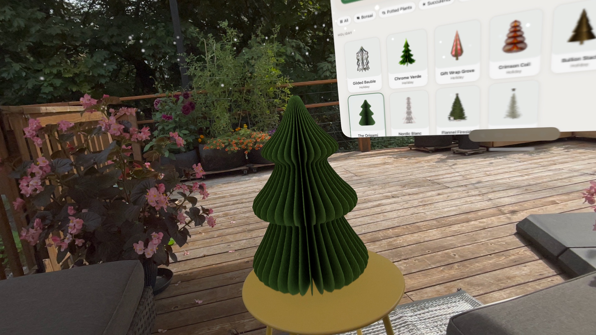 A holiday tree placed on an outdoor deck