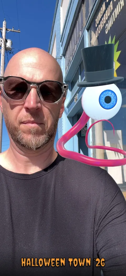 A selfie with Haunt Shot’s Top Hat Eye Ball monster.